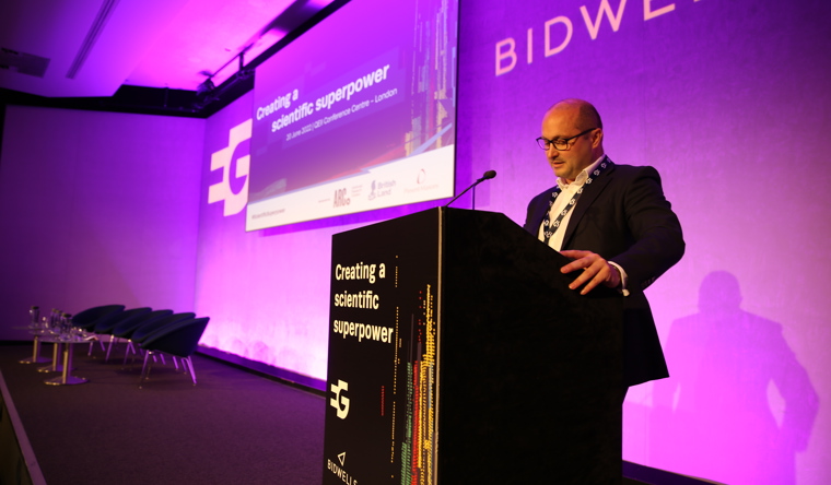 Bidwells' head of science and technology Max Bryan welcoming guests to the conference.JPG